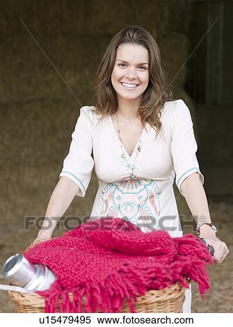 Woman in on bike with picnic basket View Large Photo Image Stock Photography - Woman in on bike with picnic basket. Fotosearch