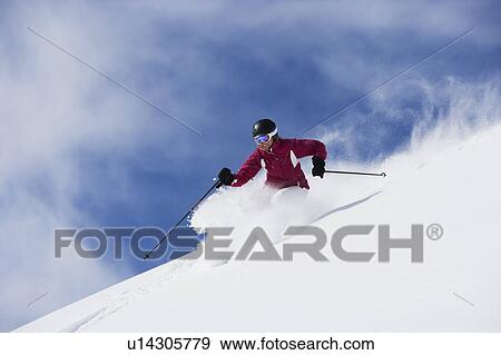 Stock Photo - Woman in red & white outfit carving.. Fotosearch