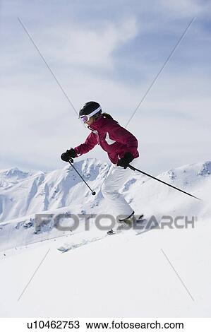 Woman in red & white outfit off-piste. View Large Photo Image Stock Image - Woman in red & white outfit off-piste.. Fotosearch