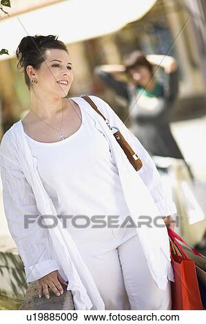 Stock Photo - woman in street situation. Fotosearch