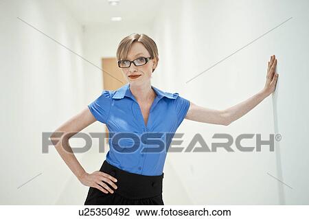 Stock Image - woman in white corridor. Fotosearch