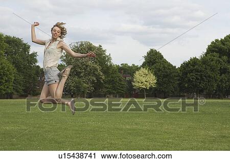 Stock Image - Woman jumping. Fotosearch
