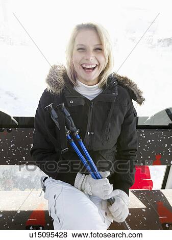 Stock Photo - woman laughing in ski lift. Fotosearch