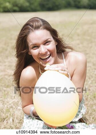 woman laughing with balloon View Large Photo Image Picture - woman laughing with balloon. Fotosearch