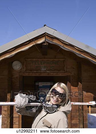 woman laughing with ski gear at hut View Large Photo Image Stock Image - woman laughing with ski gear at hut. Fotosearch