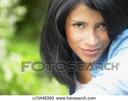Woman looking at camera, outdoors View Large Photo Image Stock Image - Woman looking at camera, outdoors. Fotosearch