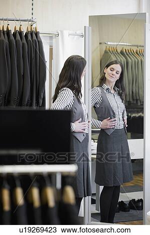 woman looking in mirror View Large Photo Image Stock Image - woman looking in mirror. Fotosearch