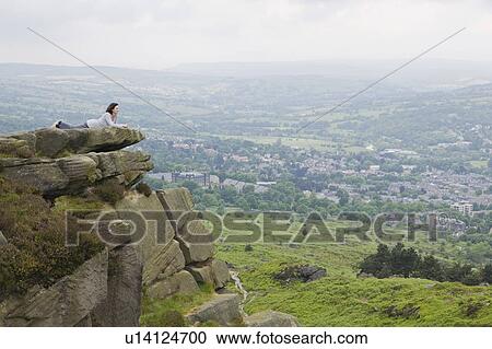 Woman lying on rock View Large Photo Image Stock Image - Woman lying on rock. Fotosearch