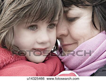 Stock Photograph - Woman mothering a child. Fotosearch