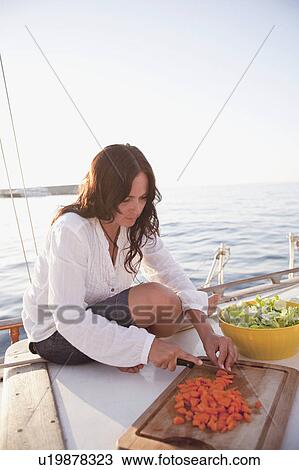 woman on boat preparing food View Large Photo Image Stock Image - woman on boat preparing food. Fotosearch