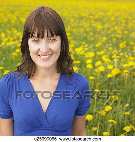 Woman on meadow View Large Photo Image Stock Photograph - Woman on meadow. Fotosearch