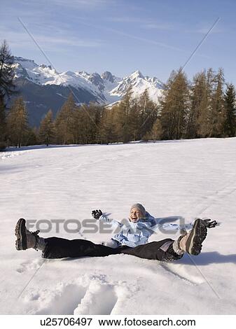 woman playing in the snow View Large Photo Image Stock Photo - woman playing in the snow. Fotosearch