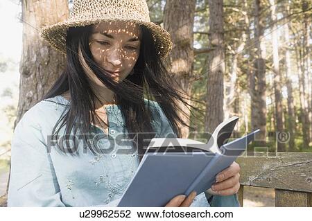 Woman reading book View Large Photo Image Stock Image - Woman reading book. Fotosearch
