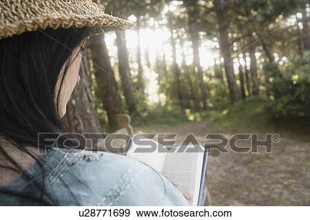 Stock Photo - Woman reading book. Fotosearch
