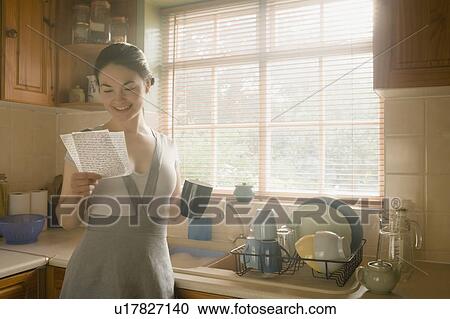 Stock Image - Woman reading letter. Fotosearch