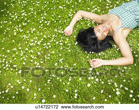 Woman resting in the garden View Large Photo Image Stock Image - Woman resting in the garden. Fotosearch