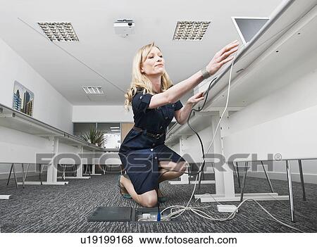 woman setting up presentation View Large Photo Image Stock Photo - woman setting up presentation. Fotosearch