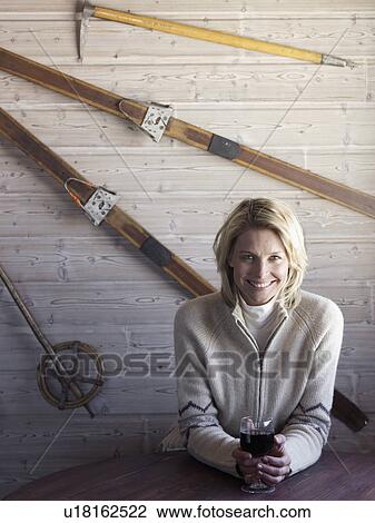woman sitting at ski lodge table View Large Photo Image Stock Image - woman sitting at ski lodge table. Fotosearch