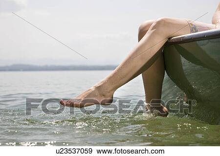 woman sitting on boat on lake View Large Photo Image Stock Photo - woman sitting on boat on lake. Fotosearch