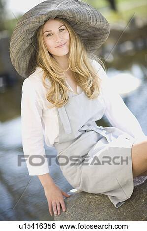 woman sitting on stone View Large Photo Image Stock Photograph - woman sitting on stone. Fotosearch