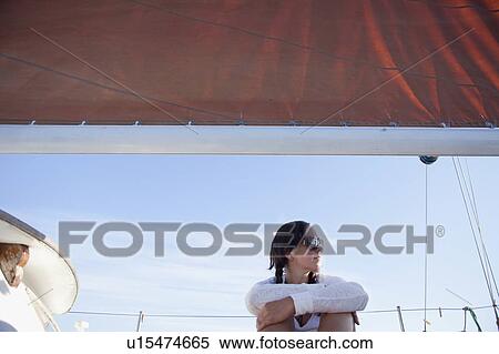 woman sitting under a sail View Large Photo Image Stock Photography - woman sitting under a sail. Fotosearch