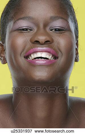 Woman smiling in studio View Large Photo Image Stock Photo - Woman smiling in studio. Fotosearch