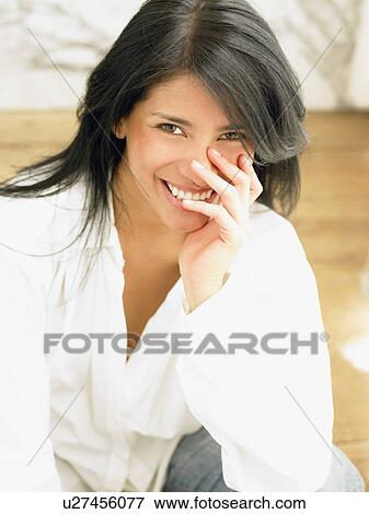 Stock Photo - Woman smiling to camera. Fotosearch