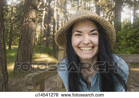 Stock Photo - Woman smiling towards camera. Fotosearch