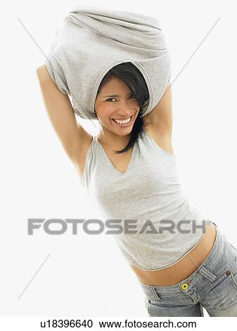 Woman taking off her sweater View Large Photo Image Stock Image - Woman taking off her sweater. Fotosearch