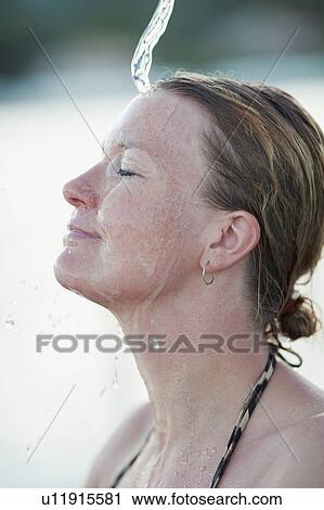 woman taking shower smiling View Large Photo Image Stock Image - woman taking shower smiling. Fotosearch
