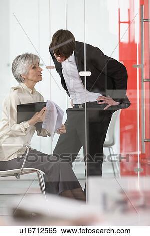 woman teach something to a trainee View Large Photo Image Stock Photography - woman teach something to a trainee. Fotosearch