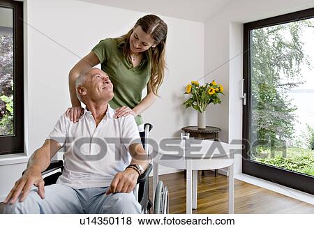 woman touching man in wheelchair View Large Photo Image Stock Photo - woman touching man in wheelchair. Fotosearch