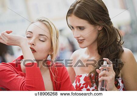 woman tries a perfume View Large Photo Image Stock Photo - woman tries a perfume. Fotosearch