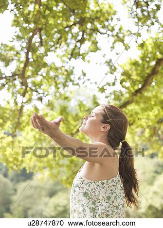 woman under tree View Large Photo Image Stock Image - woman under tree. Fotosearch