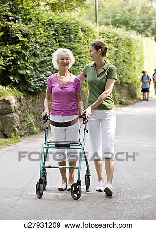 woman walking with senior woman View Large Photo Image Stock Photo - woman walking with senior woman. Fotosearch
