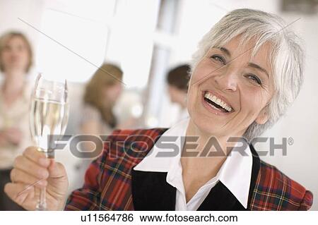 woman with a champagne glass View Large Photo Image Stock Photograph - woman with a champagne glass. Fotosearch