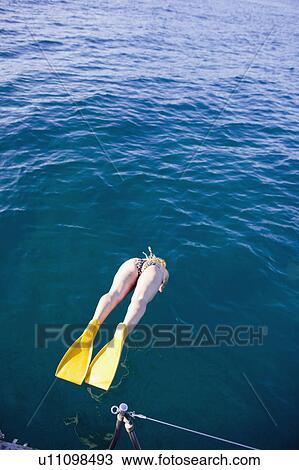 woman with flippers jumping into water View Large Photo Image Stock Image - woman with flippers jumping into water. Fotosearch