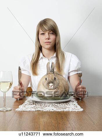 Woman with living rabbit on her plate View Large Photo Image Stock Image - Woman with living rabbit on her plate. Fotosearch