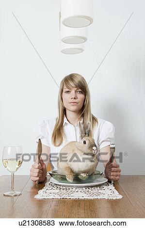 Woman with living rabbit on her plate View Large Photo Image Stock Image - Woman with living rabbit on her plate. Fotosearch