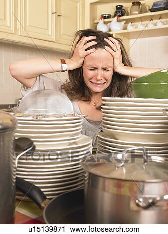 woman with piles of washing up View Large Photo Image Stock Image - woman with piles of washing up. Fotosearch