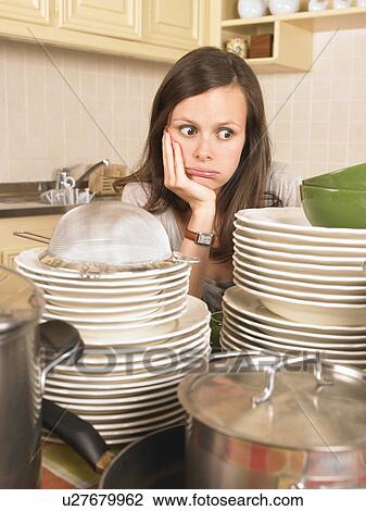 woman with piles of washing up View Large Photo Image Stock Image - woman with piles of washing up. Fotosearch