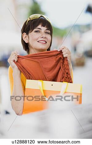 Stock Image - woman with shopping bag. Fotosearch
