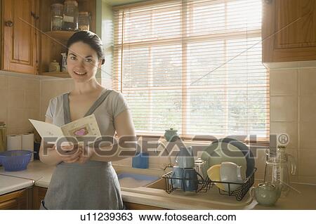 Stock Image - Woman with Valentines card. Fotosearch