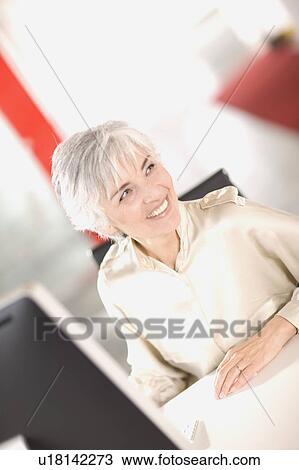 woman working in an office View Large Photo Image Stock Image - woman working in an office. Fotosearch