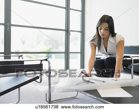 woman working on blueprints View Large Photo Image Stock Photo - woman working on blueprints. Fotosearch