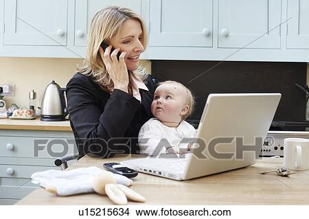 woman working with a baby View Large Photo Image Picture - woman working with a baby. Fotosearch