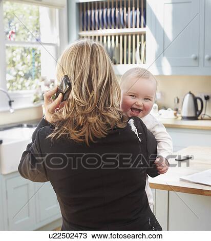 woman working with a baby View Large Photo Image Stock Image - woman working with a baby. Fotosearch