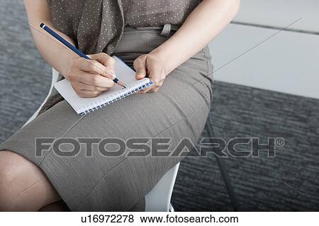 woman writing on notepad View Large Photo Image Stock Photo - woman writing on notepad. Fotosearch