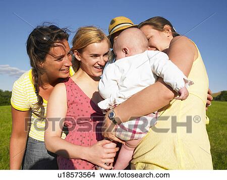 women admiring baby View Large Photo Image Picture - women admiring baby. Fotosearch