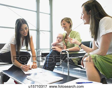 Stock Photo - women at the office. Fotosearch